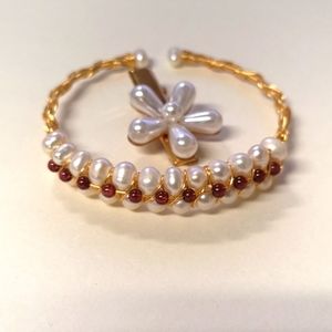 Gold and pearl costume jewelry.